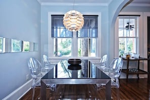 Elegant glass dining table with acrylic chairs for 4