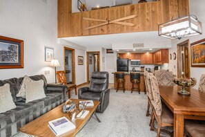 View of Spacious Great room from the fireplace - nice vaulted ceilings to give it a penthouse feel