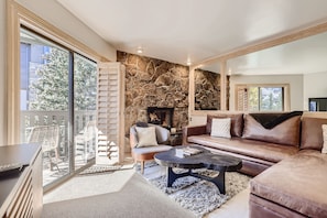 Open living area - Gas fireplace and great deck with views of Vail Mountain