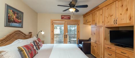 Viking Lodge 212 - the king master bedroom is super cosy and opens to a private balcony overlooking the river.