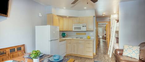 Open Kitchen and Dining area leading to the bunk area, bathroom and sleeping space.