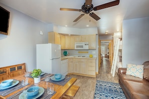 Open Kitchen and Dining area leading to the bunk area, bathroom and sleeping space.