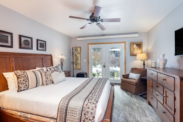 The bedroom opens right out to a patio & garden.
The bedroom has a queen bed, flat screen TV & plenty of closet space.