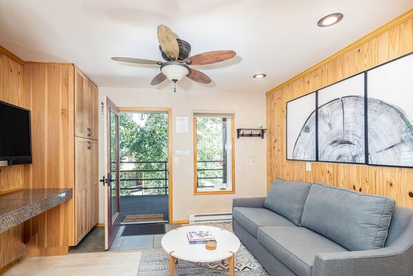 Spacious living area for relaxing after a fun filled day.  Flat screen tv for watching movies.