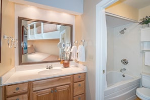 Viking Lodge 315 - next to the bunks is the bathroom with tub/shower combo and separate vanity.