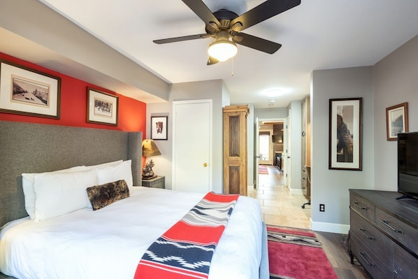 Pass through the bedroom by the bathroom, then into the living and kitchen area. There is a patio on the river trail just out the back door.