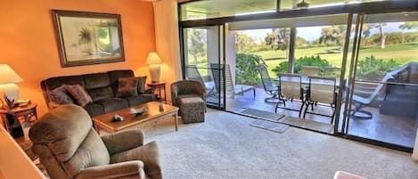 Spacious living room with large lanai for eating and relaxing.