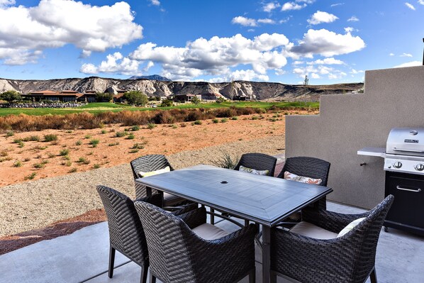 Back Patio - The back patio includes patio furniture for 6 and includes a BBQ grill