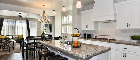 Kitchen Island - The Kitchen Island comfortably seats 3 adults and creates a great space for serving and preparing meals.