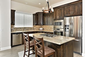 Kitchen Island - The Kitchen Island seats 2 adults and creates a great space for serving and preparing meals.