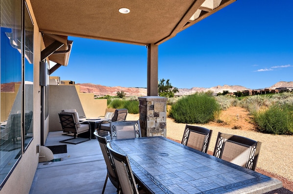 Back Patio Dining Table View - BBQ your favorite dish and eat on the patio table while enjoying the view.