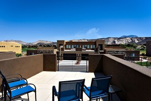 Front Patio View - The Front Patio offers comfortable lounging with views of the 18th hole at The Ledges Golf Club.