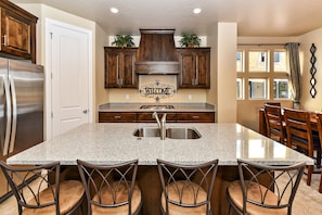 Kitchen Island - The Kitchen Island comfortably seats 4 adults and creates a great space for serving and preparing meals.