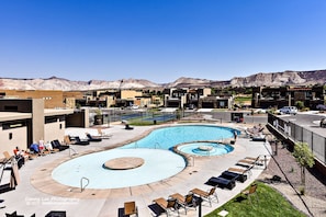 Private Balcony Pool View - Te back view from our private balcony overlooks the neighborhood pool.  Our home is conveniently located next to the neighborhood amenities.