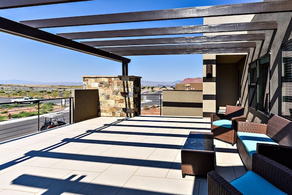 Front Patio Pergola View - Enjoy the weather under the pergola while sitting in our comfortable patio furniture.