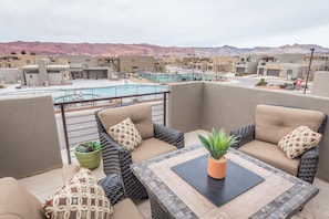 Balcony View of Community Pool - Our home is conveniently located across the street from the community pool and pickleball courts.  From the upstairs balcony you can watch your kids play in the pool.