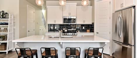 Kitchen Island - The Kitchen Island comfortably seats 4 adults and creates a great space for serving and preparing meals.