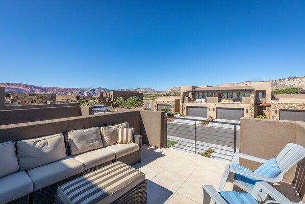 Front Patio View - The Patio Deck is a spacious area to entertain guests while enjoying the beautiful surrounding landscapes of Snow Canyon State Park.