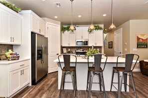 Kitchen Island - The Kitchen Island comfortably seats 3 adults and creates a great space for serving and preparing meals