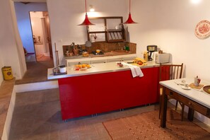 Furniture, Flooring, Interior Design, Kitchen, Countertop, Lighting, Floor, Cabinetry, Room, Kitchen Appliance