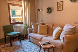 Furniture, Interior Design, Flooring, Wood, Couch, Floor, Room, Living Room, Table, Lighting