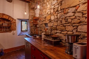Interior Design, Flooring, Ceiling, Furniture, Room, Kitchen, Wood Stain, Brick, Light Fixture, Countertop