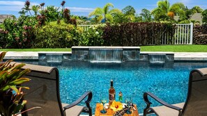 Pool Area with waterfall features and poolside seating