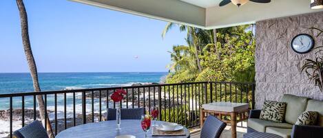 Lanai with table, chairs, and ceiling fan.