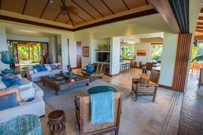Living area with two couches and chairs.