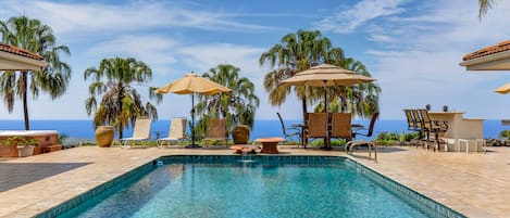 Large Private Pool with poolside tables and seating at this Kona Hawai'i vacation rental/