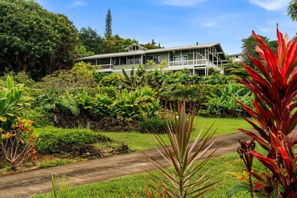 Perched High Above the Kona Coastline and Overlooking 1 & 1/2 acres of lushly landscaped grounds