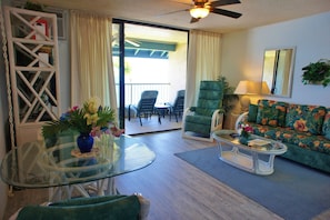 Dining room set, ceiling fan, sofa, armchair, and coffee table