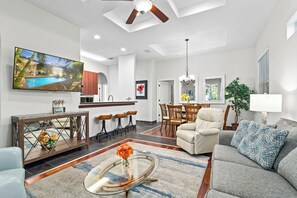 Main living area, living room, dining area and kitchen with breakfast bar.