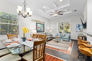 Dining area with living room shown.
