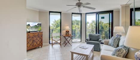 Living area with balcony access.