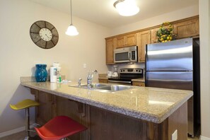 The spacious Granite Counter Tops make for easy meal preparation. 