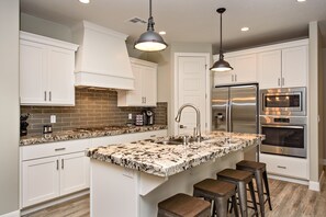 Kitchen Island - The Kitchen Island comfortably seats 4 adults and creates a great space for serving and preparing meals.