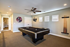 Entertainment room - Located upstairs the entertainment room includes a pool table and access to the outside front patio.