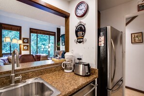 Another view of kitchen looking into living room