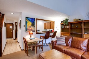 Living room with serving bar and dining area