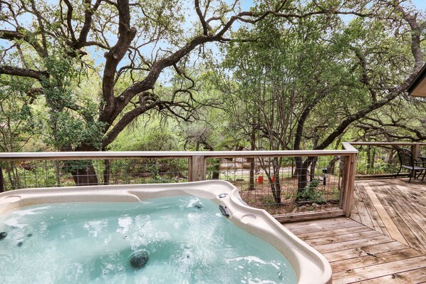 Enjoy a relaxing evening in the hot tub overlooking the creek
