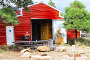 The Horse Barn includes 3 cabin suites (Bed and Bath), Kitchen, 1 Common Bathroom, and a large gathering area.