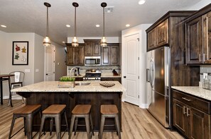 Kitchen Island - The Kitchen Island comfortably seats 4 adults and creates a great space for serving and preparing meals.