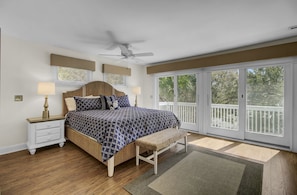 Primary bedroom with rustic beachy charm.