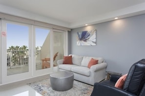 Enjoy a luxury vacation in our family-friendly condo. With a view of the tropical landscapes and pool areas, our living space feels like paradise.