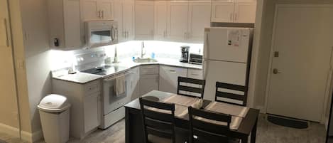 Kitchen with new table and chairs. 
New ceiling fan with remote.