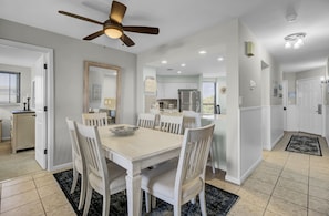 Dining area for six, plus 4 at the breakfast table, and two at the breakfast bar.