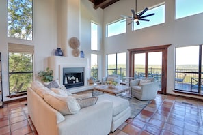 Formal living area with decorative fireplace