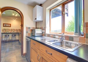 Utility room adjacent to the kitchen