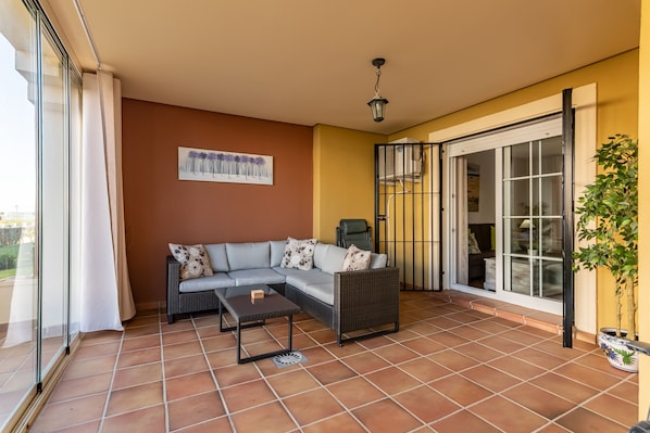 View of the large terrace with lounge and dining area.